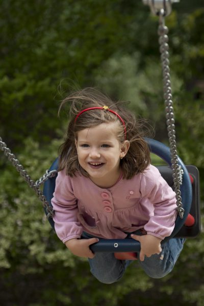 preschool child on swing